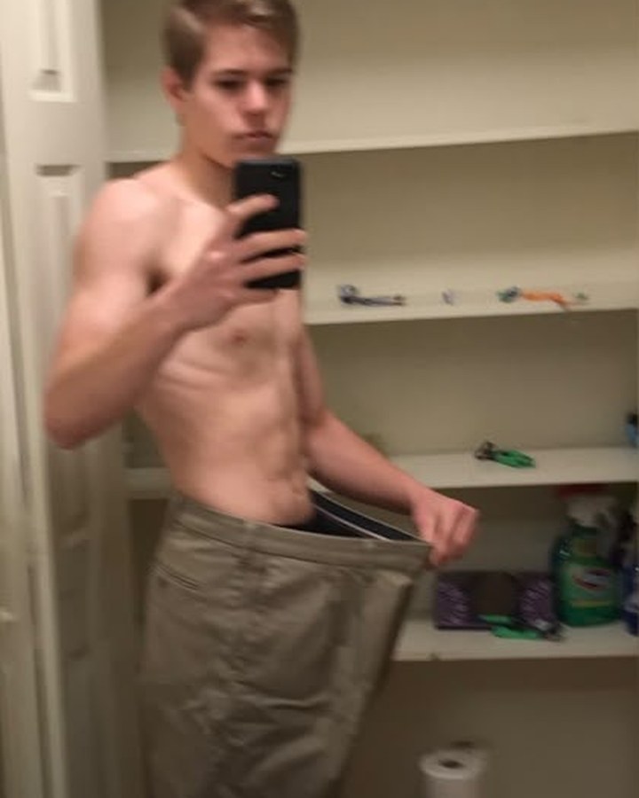 David Roupas in 2021 holding out his old trousers after losing 100lbs